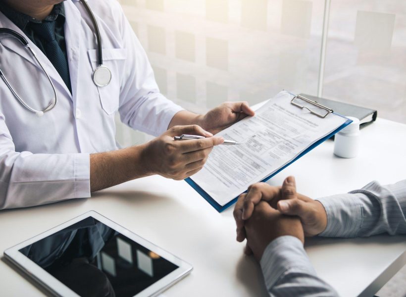 doctor-is-writing-the-appointment-letter-to-the-patient-at-the-clinic-.jpg